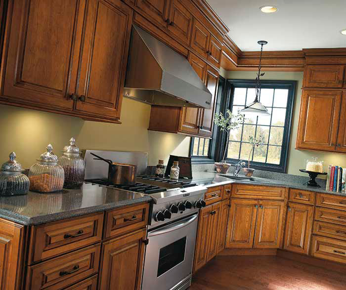 Traditional cherry kitchen cabinets by Diamond Cabinetry