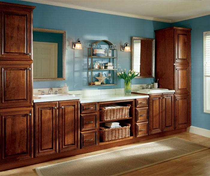Traditional cherry bathroom cabinets by Diamond Cabinetry