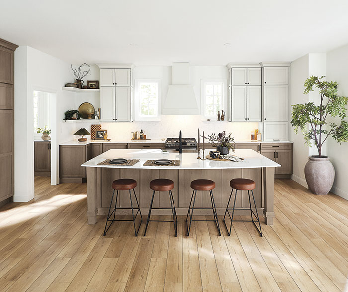 kitchen with white wall cabinets, open shelves, and wood hood and medium stained base, pantry, and island cabinets